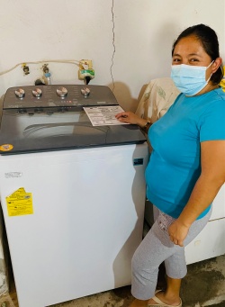 Hilda checks out the new washing machine at PuRR Project in Puerto Vallarta