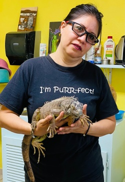 Eva posing with an iguana