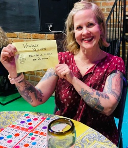 A bingo winner holding up her prize
