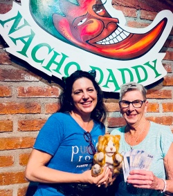 A purr volunteer and a bingo winner