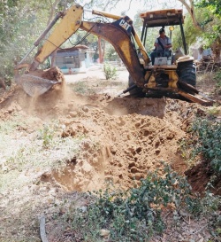 A large hole and a tractor