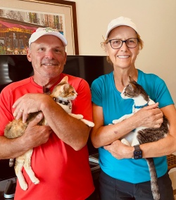 Couple with their new kitties